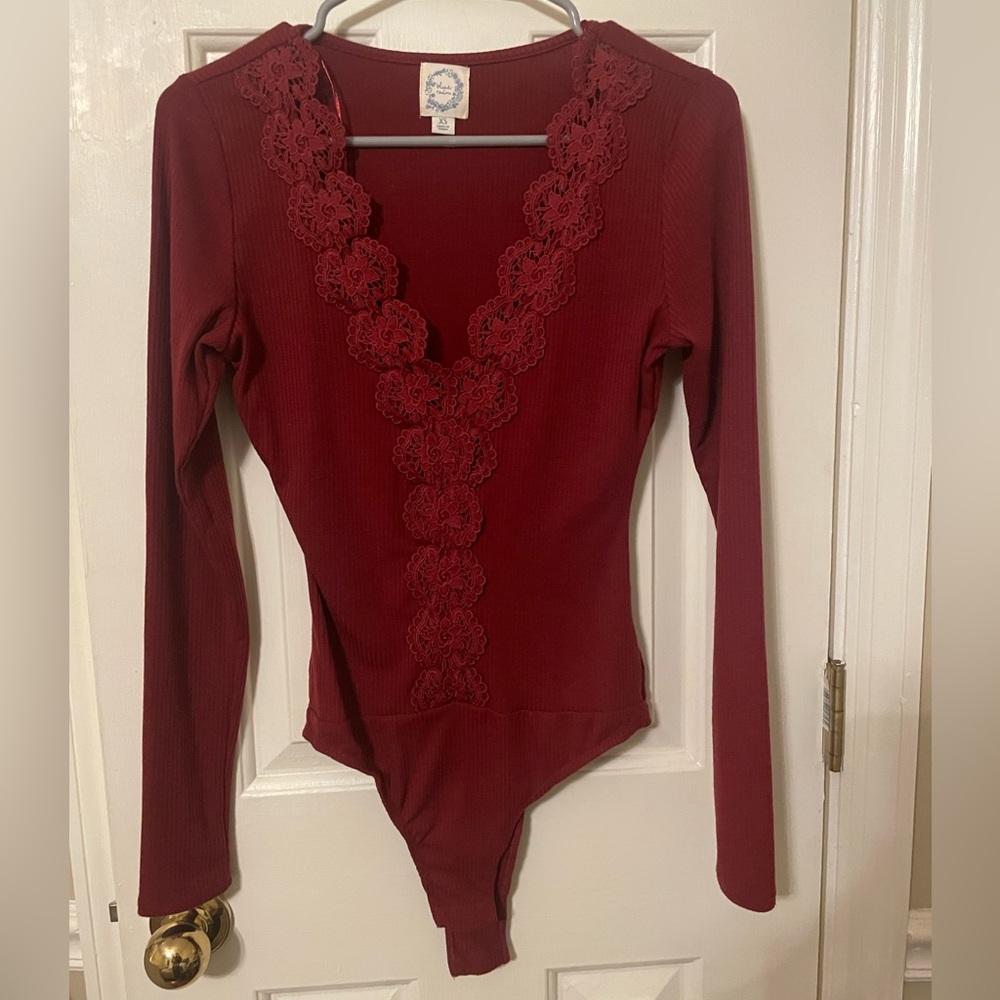 Blue Rain. Dark red ribbed lace body suit. Long sleeve. Size x-small.